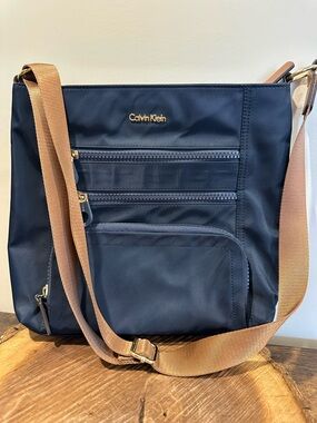 Calvin Klein Navy Crossbody Bag with Tan Strap